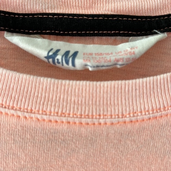 H&M peach colored top with design in front. Size 12 - Picture 3 of 4
